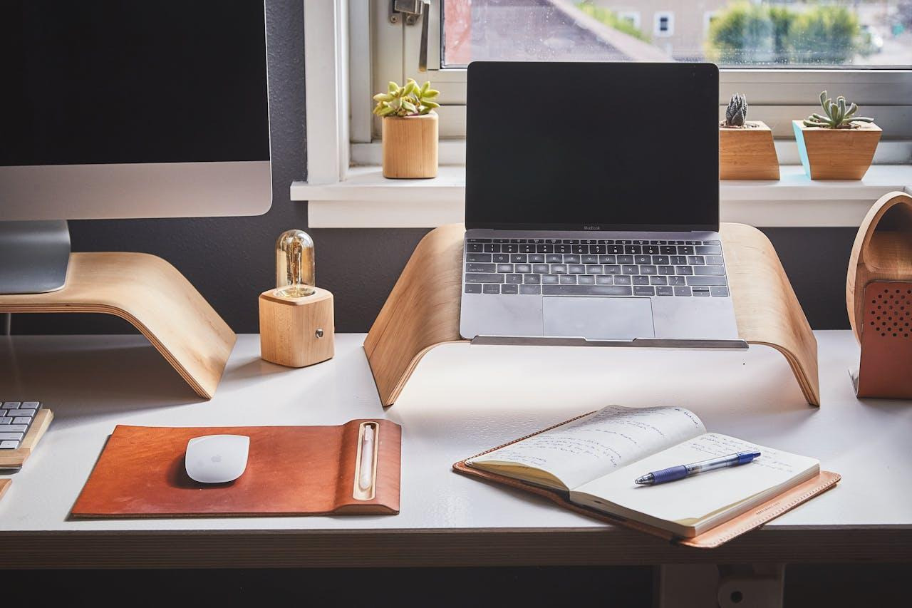 A silver laptop on a white desk